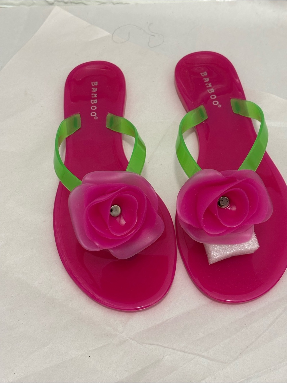 BAMBOO Hot Pink Jelly Thong Sandals with Green Straps and Flower Accent